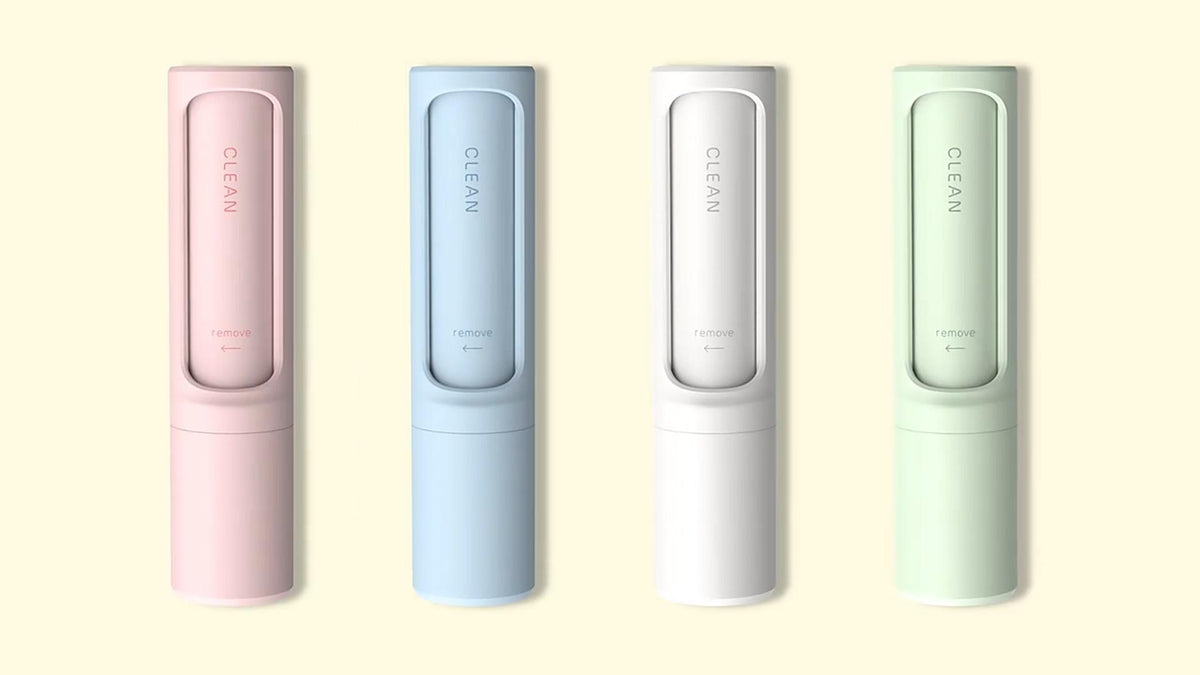 The Pocket Reset lint brush in white, pink, green, and blue