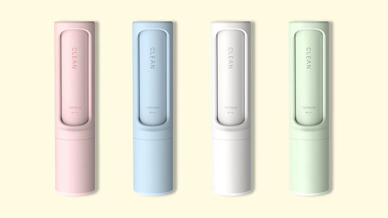 The Pocket Reset lint brush in white, pink, green, and blue